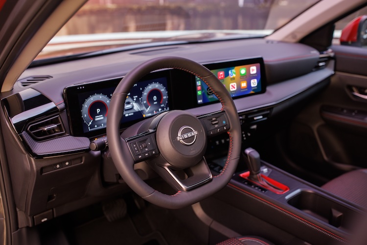 The steering wheel and dashboard and two displays in the 2025 Nissan Kicks.