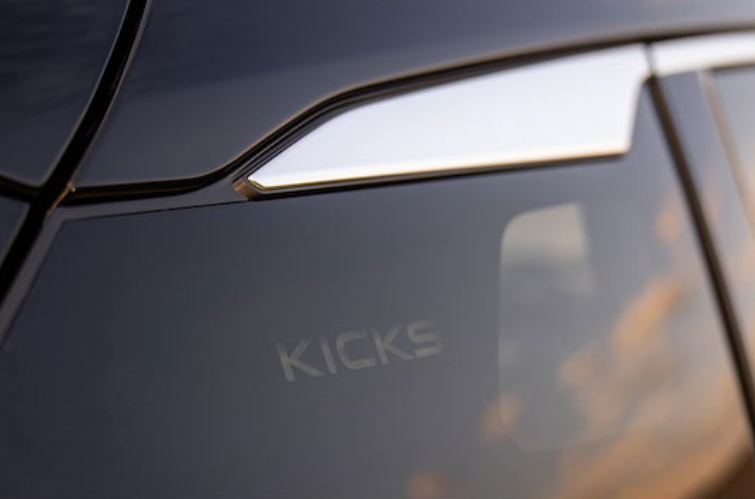 Close-up of the Kicks nameplate cut-out on the black area near the back side window on the 2025 Nissan Kicks.