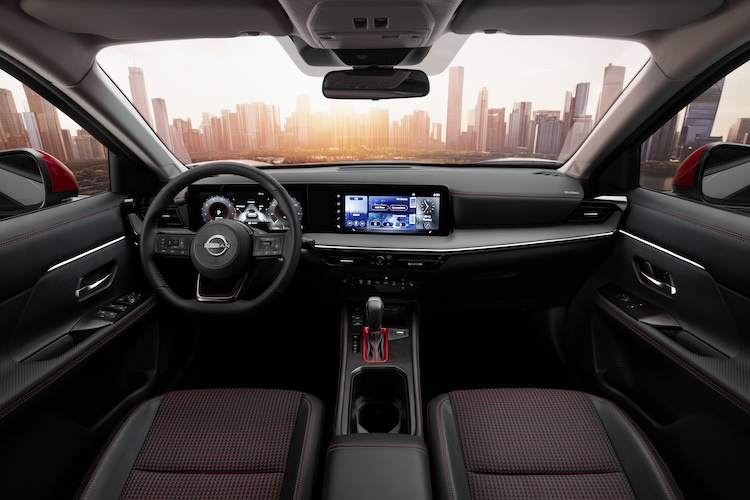 View of the dashboard, steering wheel and door interiors in the 2025 Nissan Kicks.